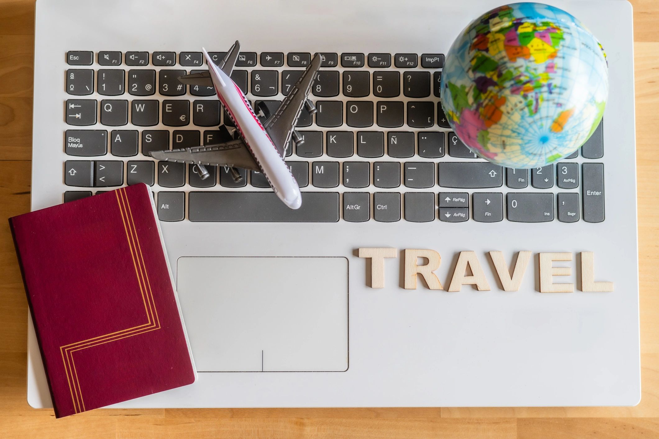 Airplane models, a world globe, a passport, and travel items